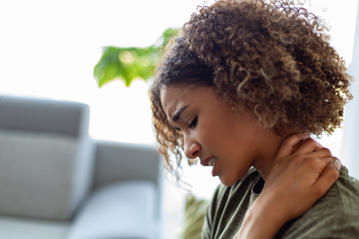 A Woman holding her neck - Entour Brand Beta-Caryophyllene Terpene - Health Benefits