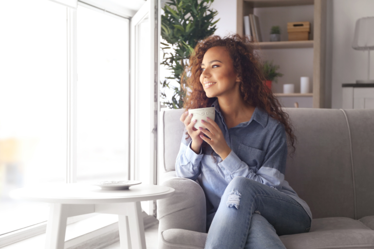 A person relaxing on a couch - Entour botanical specialists