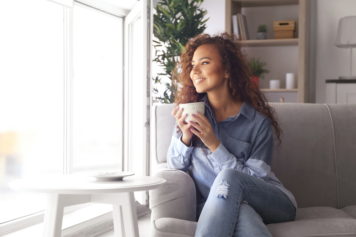 A person relaxing on a couch - Entour botanical specialists